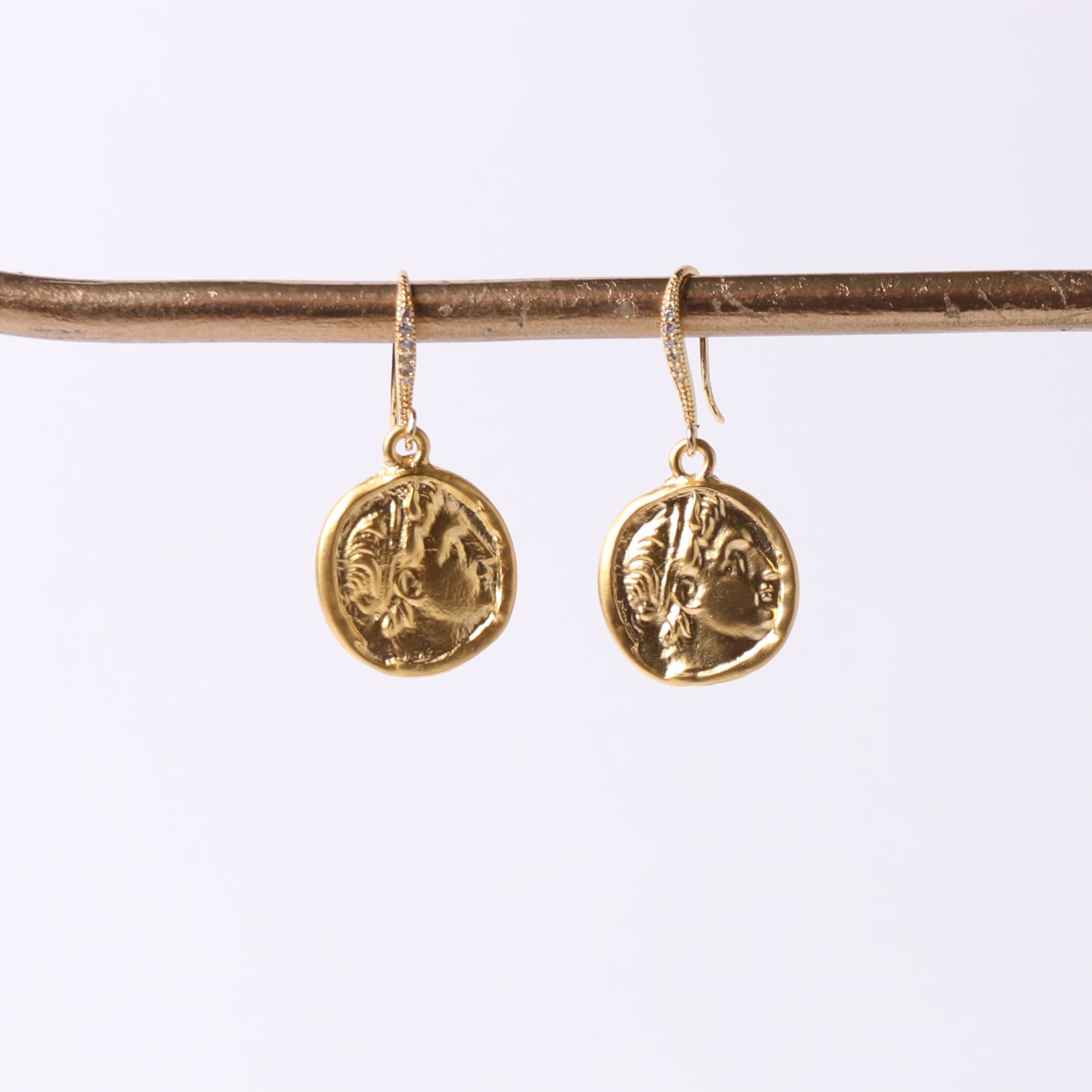 coin earrings hanging